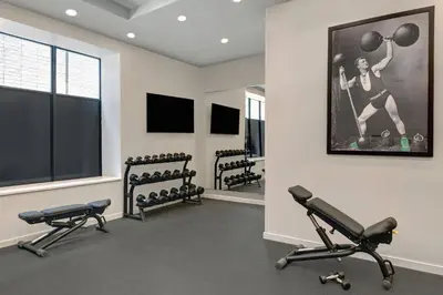 a fitness room with three rows of exercise equipment at TownePlace Suites by Marriott Cincinnati Downtown in Cincinnati