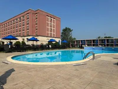 a large swimming pool in front of a hotel at Mountaineer Casino Resort in New Cumberland