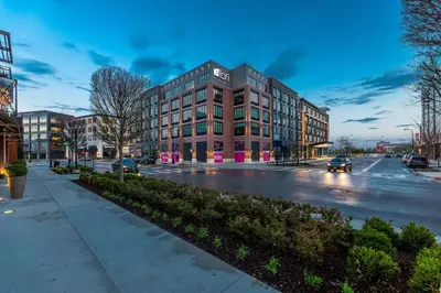 a building on a city street with cars on the street at Aloft Columbus Easton in Columbus