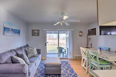 a living room with a couch and a table at Serene Abode on Lake Erie about 9 Miles to Oak Harbor in Sand Beach