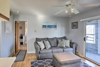 a living room with a couch and a ceiling fan at Serene Abode on Lake Erie about 9 Miles to Oak Harbor in Sand Beach