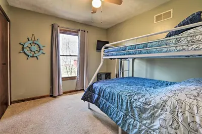 a bedroom with two bunk beds and a window at Grill, Yard and Fire Pit Huntsville Gem with Views in Huntsville