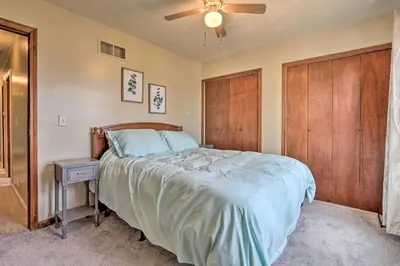 a bedroom with a bed and a ceiling fan at Grill, Yard and Fire Pit Huntsville Gem with Views in Huntsville