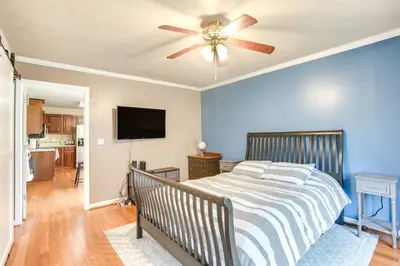 a bedroom with a bed and a ceiling fan at Grill, Yard and Fire Pit Huntsville Gem with Views in Huntsville