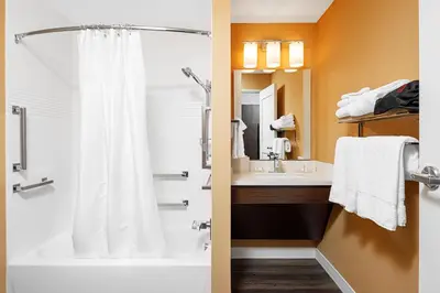 a bathroom with a shower and a sink at TownePlace Suites by Marriott Ironton in Ironton