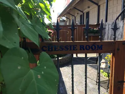 a wooden gate with a cheese room sign on it at Chessie Room in Huntington