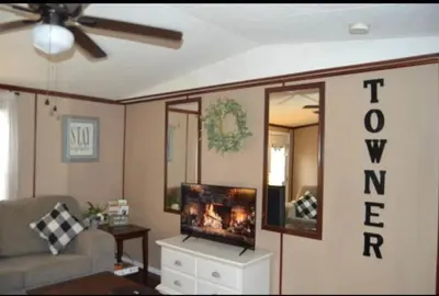 a living room with a couch and a flat screen tv at Convenient and Spacious home in Stanton, Ky in Stanton