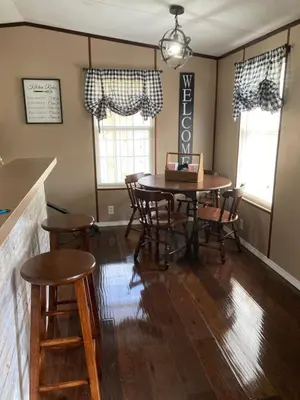 a dining room with a table and chairs at Convenient and Spacious home in Stanton, Ky in Stanton