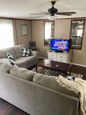 a living room with a couch and a tv at Convenient and Spacious home in Stanton, Ky in Stanton