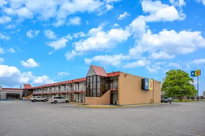 an empty parking lot in front of a building at Super 8 by Wyndham Perrysburg-Toledo in Perrysburg