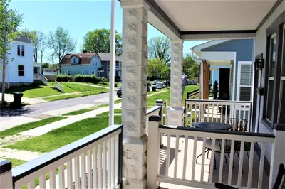 a front porch of a house with a view of a street at Chic 2BR near DT, 8 min walk to Park&Conservatory in Columbus