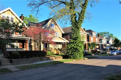 a row of houses on a residential street at Modern 2BR near DT, 8min walk to Park&Conservatory in Columbus