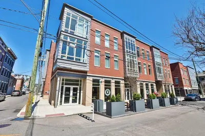 a large red brick building on a city street at **NEW mOdernLUX best OTR condo *Park ONsite** in Cincinnati