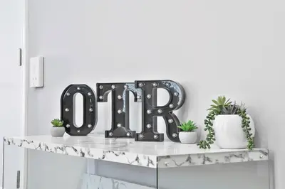 a shelf with a black iron love sign on it at **NEW mOdernLUX best OTR condo *Park ONsite** in Cincinnati