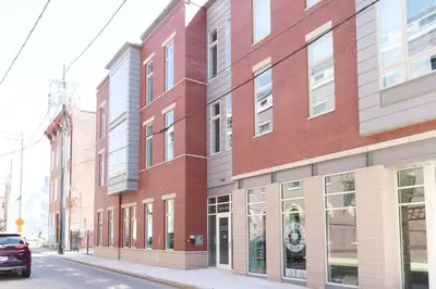 a red brick building on the side of a street at **NEW mOdernLUX best OTR condo *Park ONsite** in Cincinnati