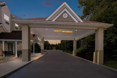 a building with a walkway leading into a driveway at Quality Inn & Suites in Washington