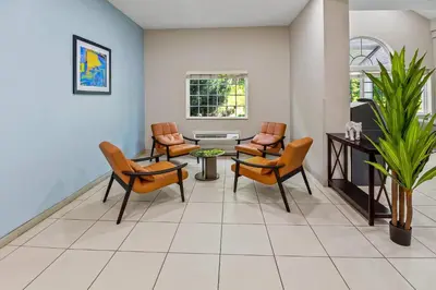 a waiting room at a hospital with chairs and a table at Quality Inn & Suites in Washington