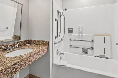 a bathroom with a sink and a shower at Quality Inn & Suites in Washington
