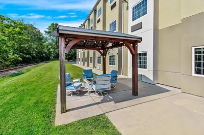 a patio with chairs and a gazebo next to a building at Quality Inn & Suites in Washington