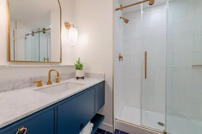 a bathroom with a sink and a shower at The Bradley in Fort Wayne
