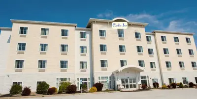 a large white building with a sign on it at Cadiz Inn in Cadiz