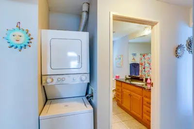 a kitchen with a washer and dryer next to a sink at Cozy Middle Bass Island Getaway On Lake Eerie! in Put-in-Bay