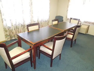 a dining room table with chairs and a wooden table at Xenia Country Inn in Xenia