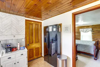 a bedroom with a bed and a shower in a room at Quiet Shiloh Retreat with Spacious Yard and Fireplace! in Shiloh