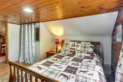 a bedroom with a bed and a wooden ceiling at Quiet Shiloh Retreat with Spacious Yard and Fireplace! in Shiloh