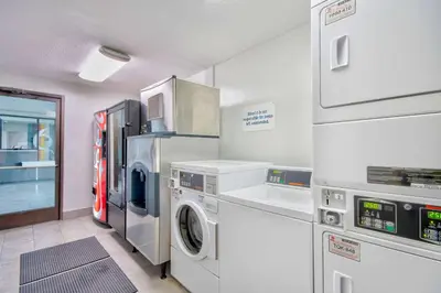 a laundry room with a washer and dryer at Studio 6 Georgetown KY Lexington North in Georgetown