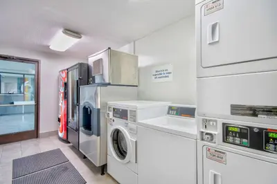 a laundry room with a washer and dryer at Studio 6 Georgetown KY Lexington North in Georgetown