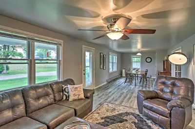 a living room with a couch and a ceiling fan at Millersburg Home with Covered Porch and Fire Pit! in Millersburg