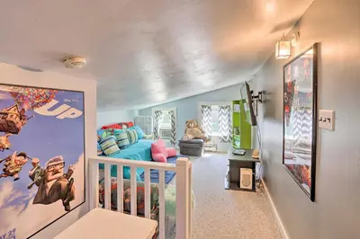 a childs room with a bed and a crib at Southeast Michigan Escape about 3 Mi to Adrian! in Adrian