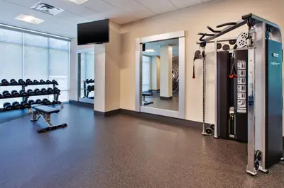a fitness room with a gym with a mirror at Homewood Suites By Hilton Columbus Easton, Oh in Columbus