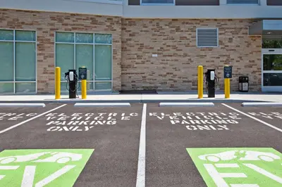 a parking lot with parking meters in front of a building at Hilton Garden Inn Columbus Easton, Oh in Columbus