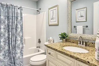 a bathroom with a sink and a toilet and a shower at Port Clinton Home with Lake Views! in Port Clinton