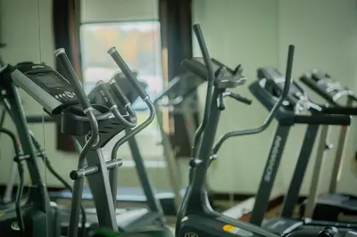 a row of exercise bikes in a gym at Royal Inn & Suites in Akron