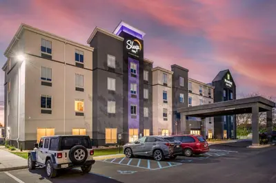 a rendering of a hotel with cars parked in a parking lot at Sleep Inn in Georgetown