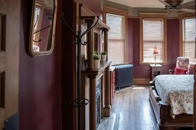 a hotel room with a bed and a window at Elk River Hotel in Sutton