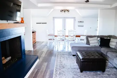 a living room with a couch and a fireplace at Cordova Farmhouse - 7 Minutes from the Ark! in Williamstown