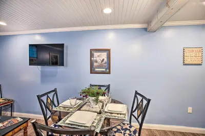 a dining room with a table and chairs at Updated Williamstown Apartment with Kitchen! in Williamstown