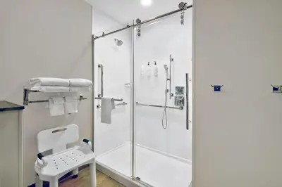 a shower with a glass door in a bathroom at Fairfield by Marriott Inn & Suites Cincinnati North West Chester in West Chester