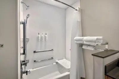 a white bathroom with a shower and a toilet at Fairfield by Marriott Inn & Suites Cincinnati North West Chester in West Chester
