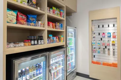a refrigerator in a store with lots of food at TownePlace Suites By Marriott Dayton Wilmington in Wilmington