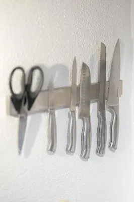 a pair of scissors hanging on a wall at Georgetown Villas 1-1b Close to Cleveland Airport and the Rocky River Valley in Fairview Park