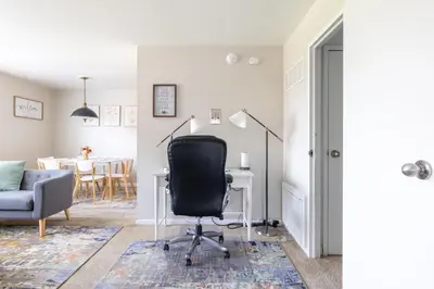 an office with a desk and a chair in a room at Georgetown Villas 2-1c King and Queen Bedrooms ideal for long stays! in Fairview Park