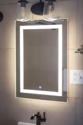 a mirror on a wall above a sink in a bathroom at Georgetown Villas 2-1c King and Queen Bedrooms ideal for long stays! in Fairview Park