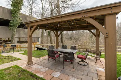 a wooden pavilion with a table and chairs on a patio at Georgetown Villas 3-2c Close to Cleveland Airport and Fairview Hospital ideal for long stays! in Fairview Park