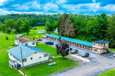 an aerial view of a building with a parking lot at Cadiz Motel by OYO on route 250 in Cadiz