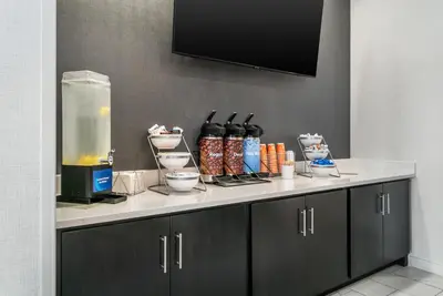 a counter in a room with a counter top with a food processor at Comfort Inn & Suites Adrian in Adrian